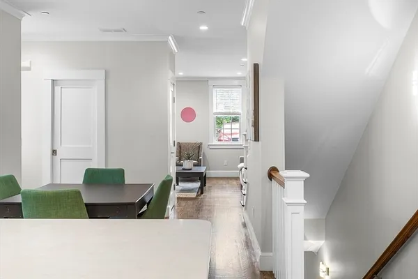 a living room with furniture and a mirror