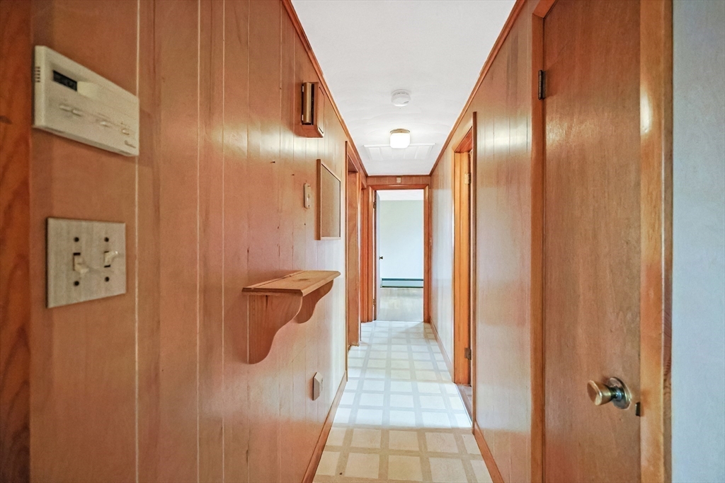 261 Adelaide Street Fall River, MA 02721 - Photo 8 of 28 a view of a hallway with wooden floor