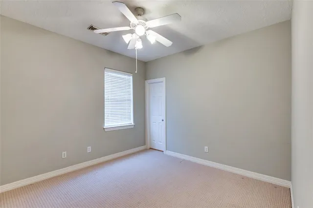 a bathroom with a granite countertop sink a mirror and a shower
