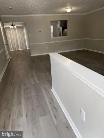 a view of swimming pool and trees in the background