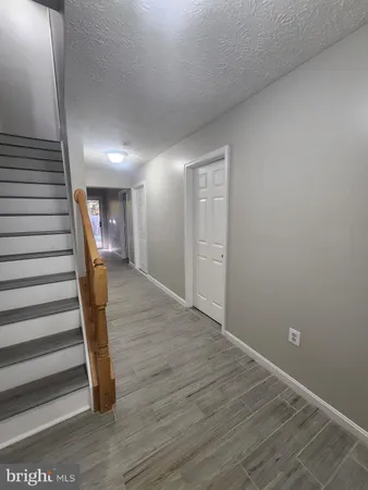a view of entryway with wooden floor
