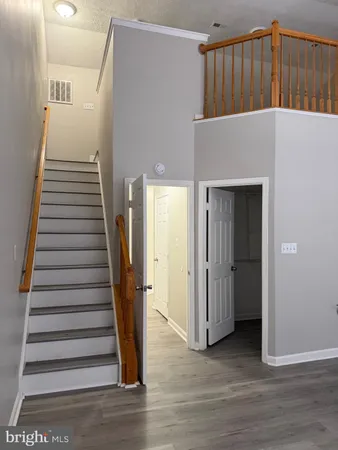 an entryway with wooden floor