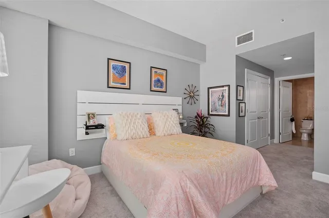 a bedroom with a bed furniture and decor