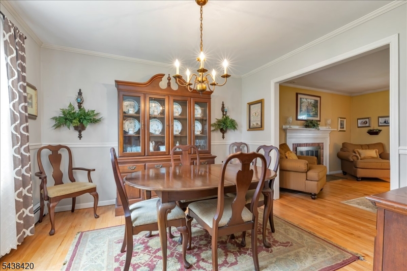 79 Main Street Califon, NJ 07830 - Photo 12 of 50 a dining room with furniture a chandelier and wooden floor