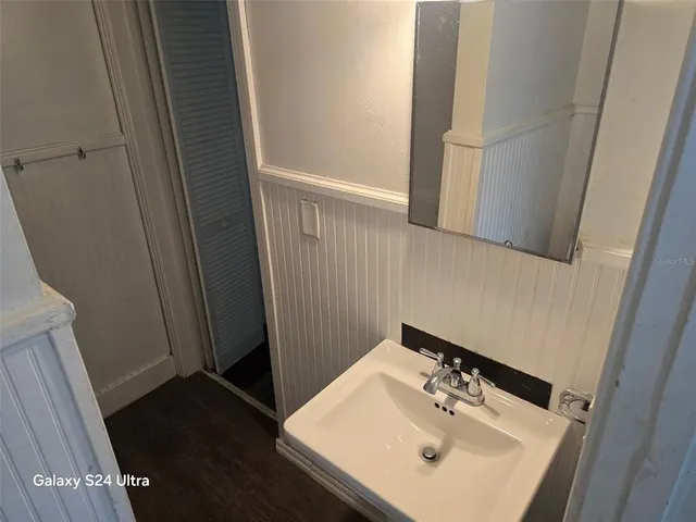 a bathroom with a sink and a mirror