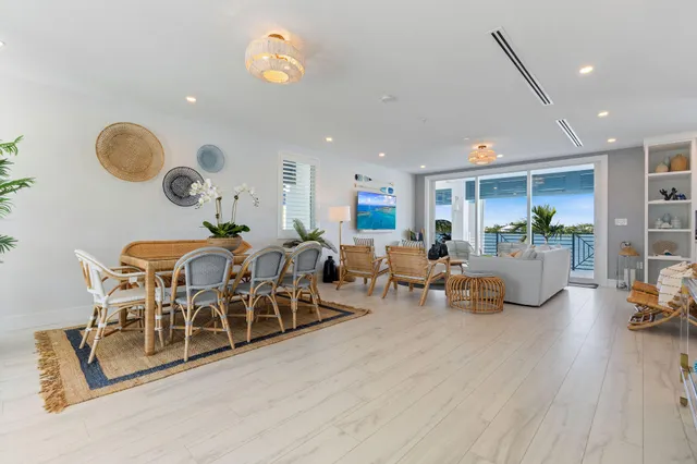a bedroom with a bed and a dresser next to a window