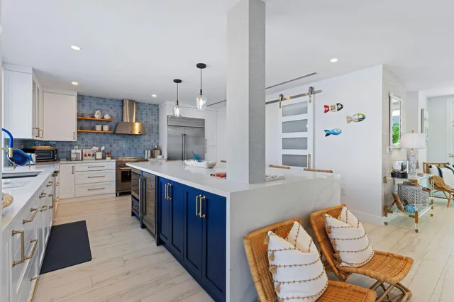 a bathroom with a toilet a sink a mirror a shower and a window