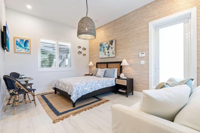 an aerial view of a house with a lake view