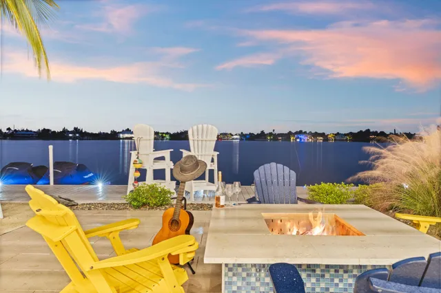 a view of a chairs and table in patio