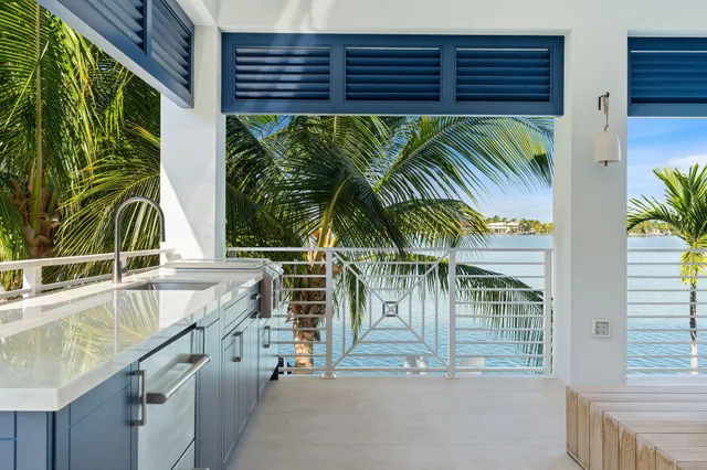 a kitchen with stainless steel appliances granite countertop a sink and a granite counter tops with a granite countertops