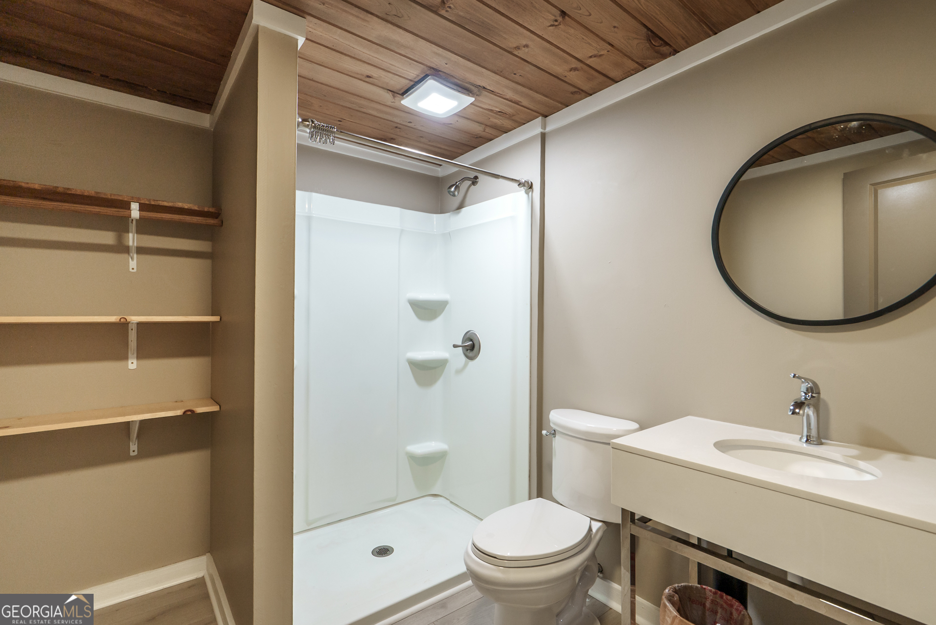 1121 Prospect Road, Unit A Madison, GA 30650 - Photo 14 of 34 a bathroom with a sink toilet and shower