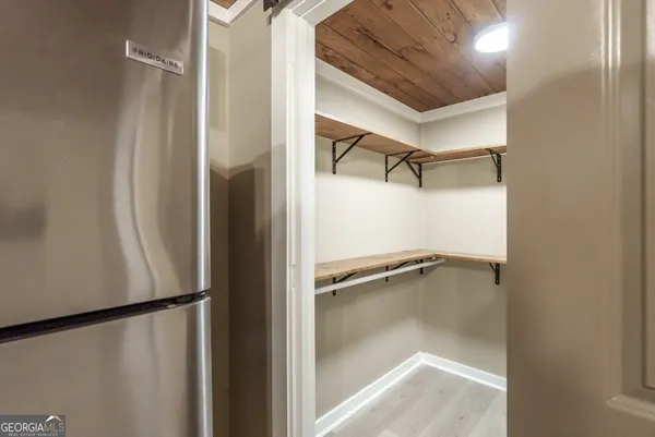 a view of a room with racks on the wall