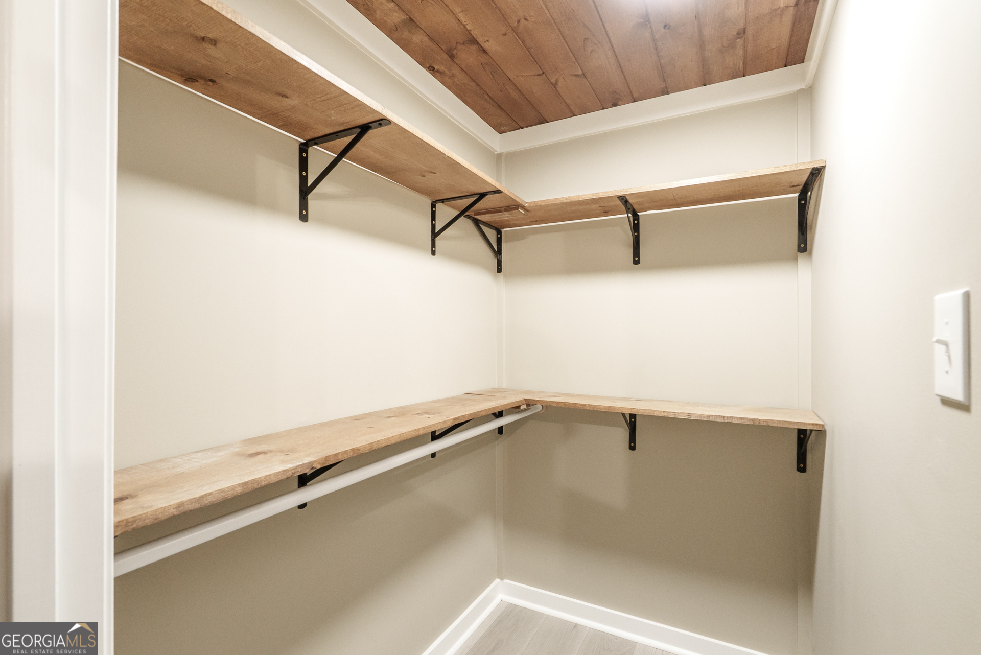 1121 Prospect Road, Unit A Madison, GA 30650 - Photo 18 of 34 a view of a room with racks on the wall