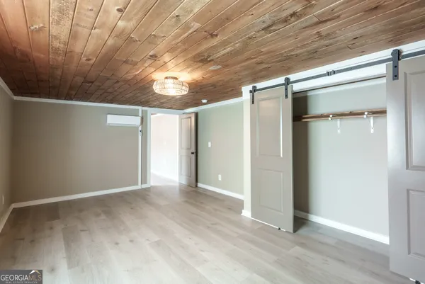 a picture of a cabinet with a white wall