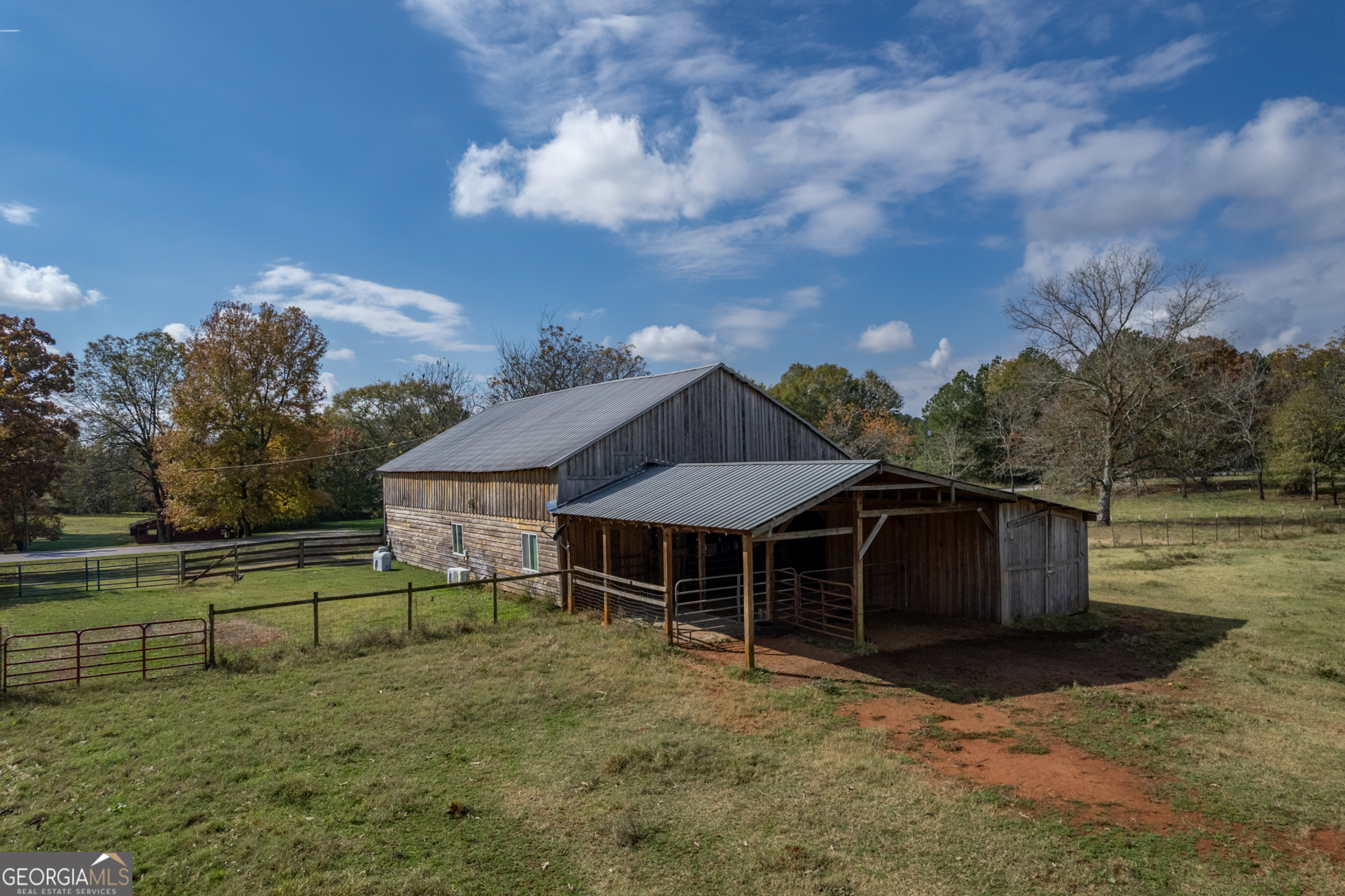 1121 Prospect Road, Unit A Madison, GA 30650 - Photo 28 of 34 a view of a house with a yard and sitting area
