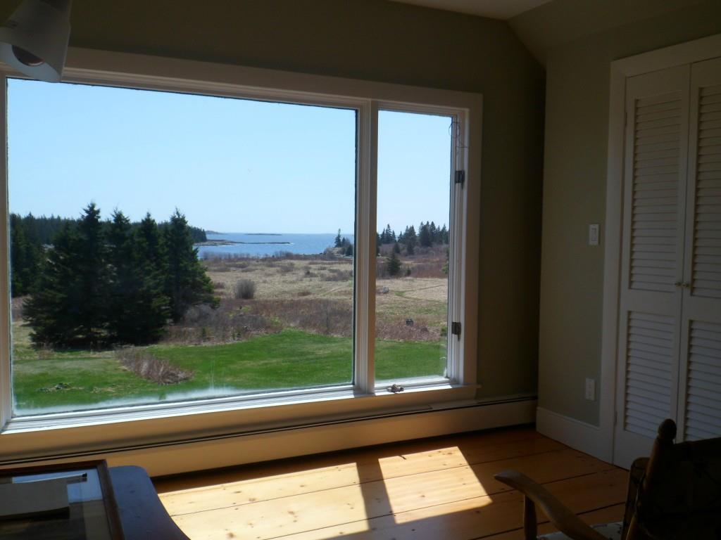 68 Lane's Island Road Vinalhaven, ME 04863 - Photo 18 of 33 Master bedroom has large windows to...