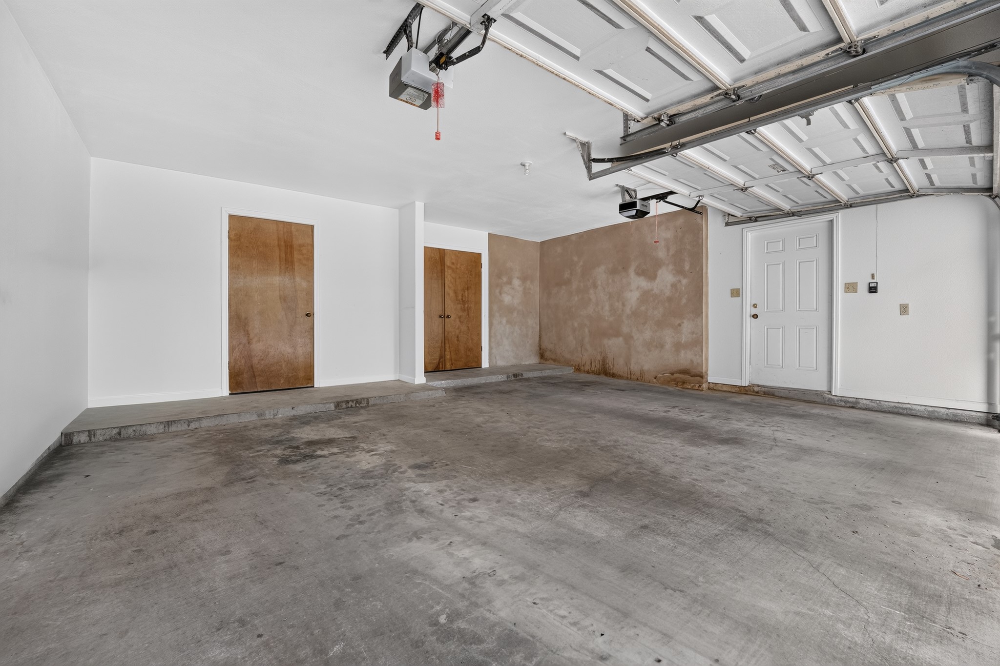 3845 Ranch Road 2222, Unit 32 Austin, TX 78731 - Photo 22 of 24 Large two car garage with extra storage