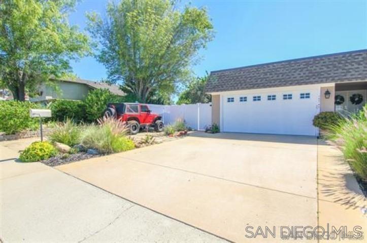 14747 Dash Way Poway, CA 92064 - Photo 2 of 23 a front view of a house with a yard and potted plants