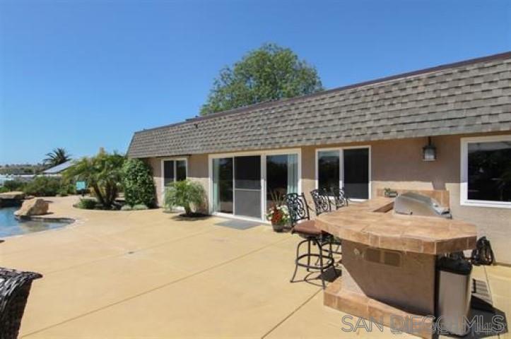 14747 Dash Way Poway, CA 92064 - Photo 11 of 23 a view of a house with backyard sitting area and porch