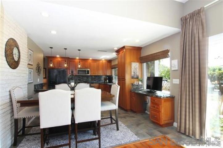 14747 Dash Way Poway, CA 92064 - Photo 18 of 23 a view of a dining room with furniture window and wooden floor