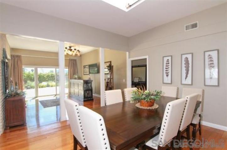 14747 Dash Way Poway, CA 92064 - Photo 5 of 23 a dining room with furniture wooden floor and a chandelier
