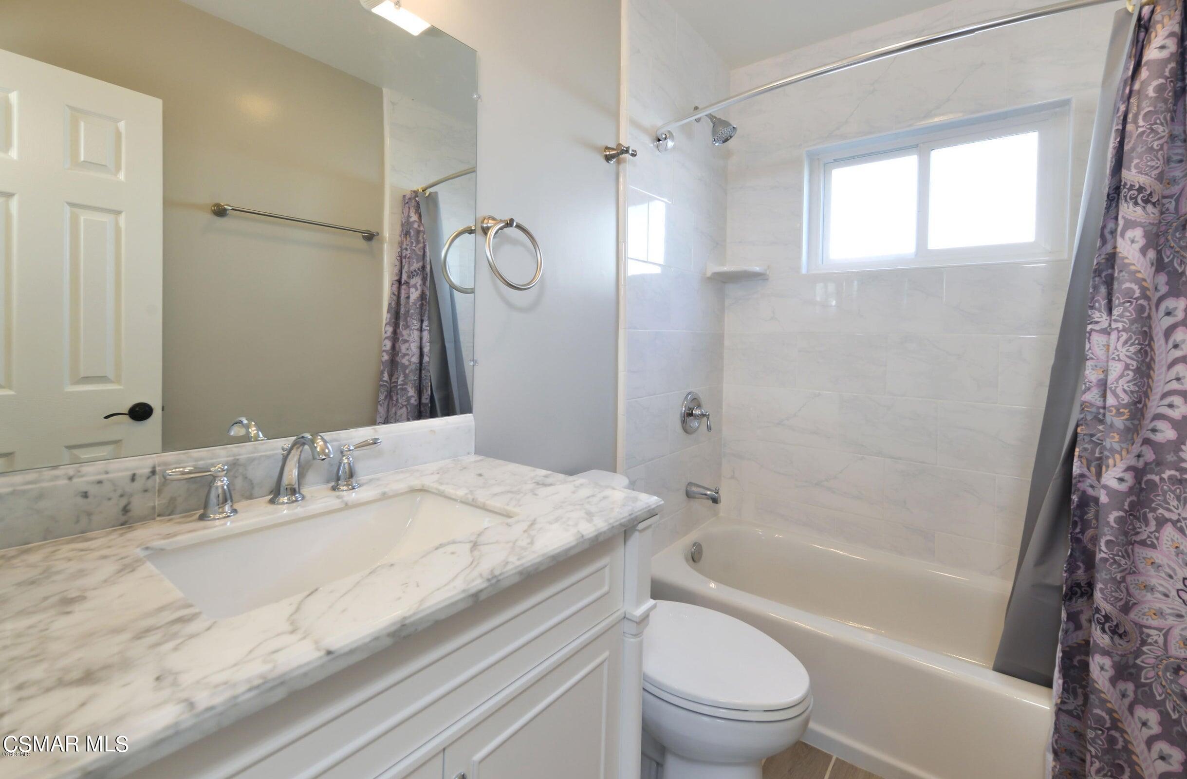 2769 Los Robles Road Thousand Oaks, CA 91362 - Photo 13 of 15 a bathroom with a granite countertop sink a toilet and shower