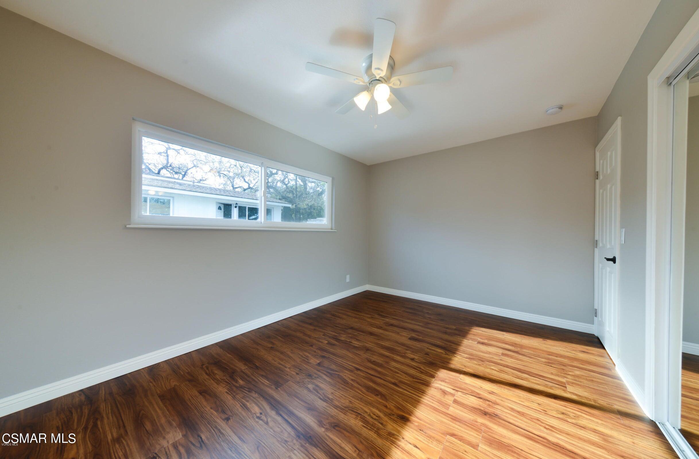 2769 Los Robles Road Thousand Oaks, CA 91362 - Photo 14 of 15 a view of a room with wooden floor and chandelier