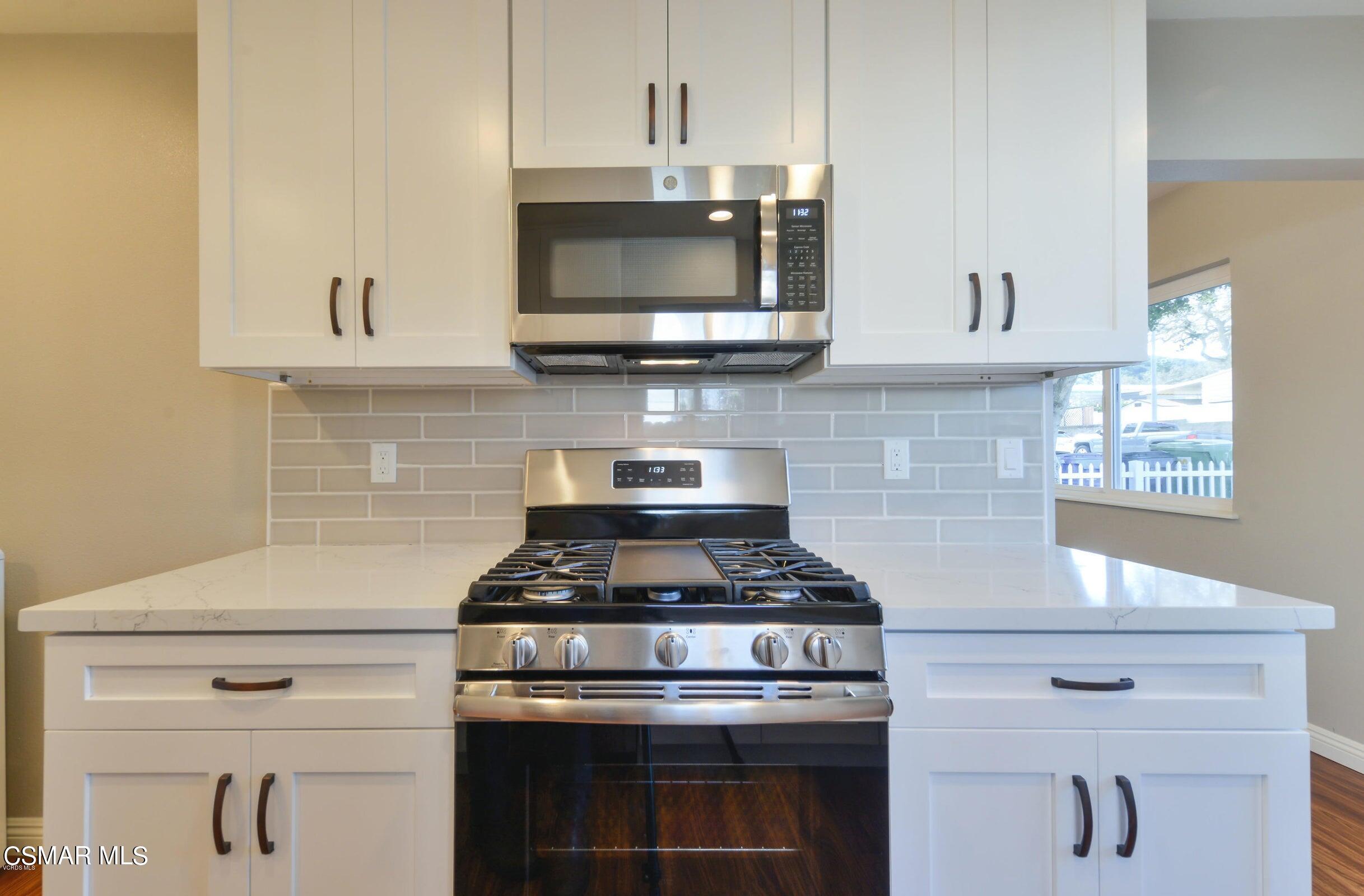 2769 Los Robles Road Thousand Oaks, CA 91362 - Photo 6 of 15 a kitchen with stainless steel appliances granite countertop white cabinets and stove