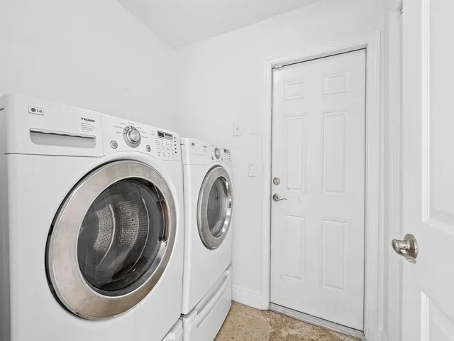 a utility room with dryer and washer