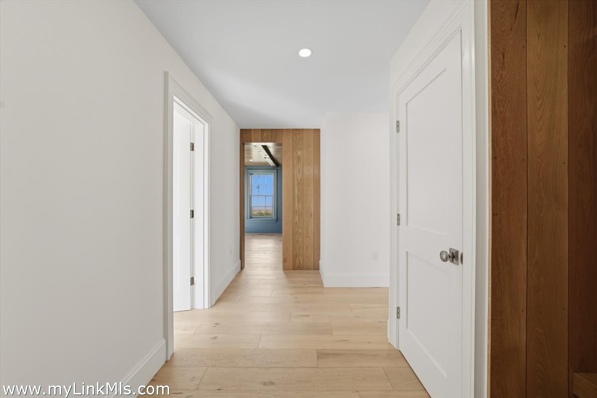 85 Orange Street Nantucket, MA 02554 - Photo 37 of 89 a view of a hallway with wooden floor