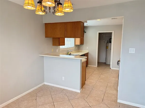 a view of backyard with wooden fence