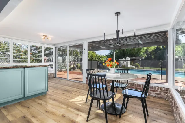 a view of a dining room with furniture window and outside view