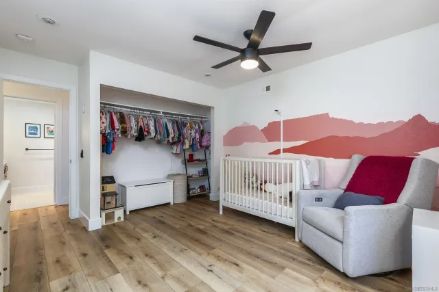 a bedroom with furniture and a window