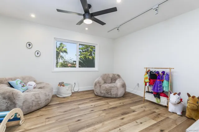 a bedroom with furniture and a window