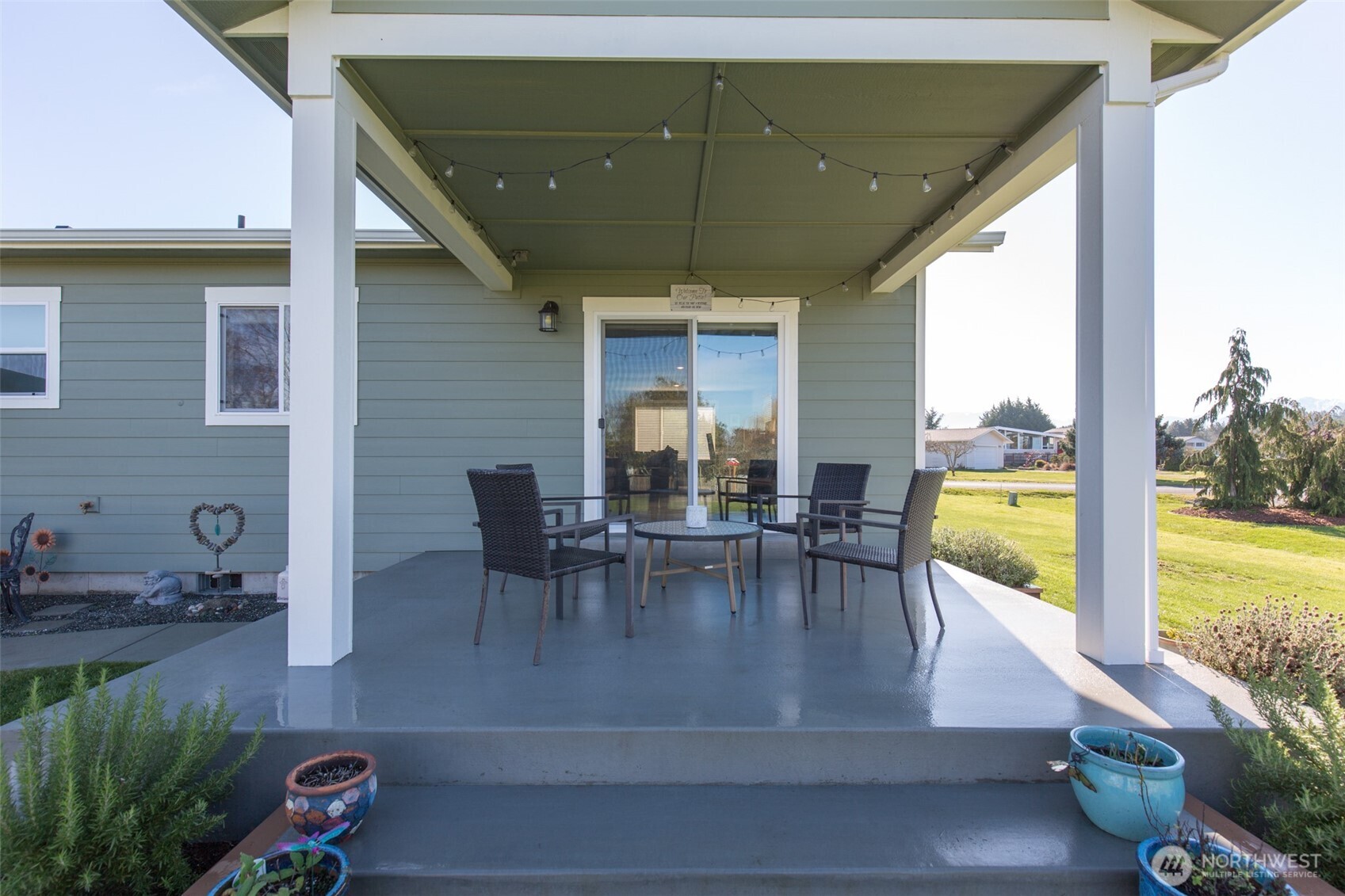 41 Victoria View Street Sequim, WA 98382 - Photo 23 of 40 a dining room with furniture water view and a floor to ceiling window