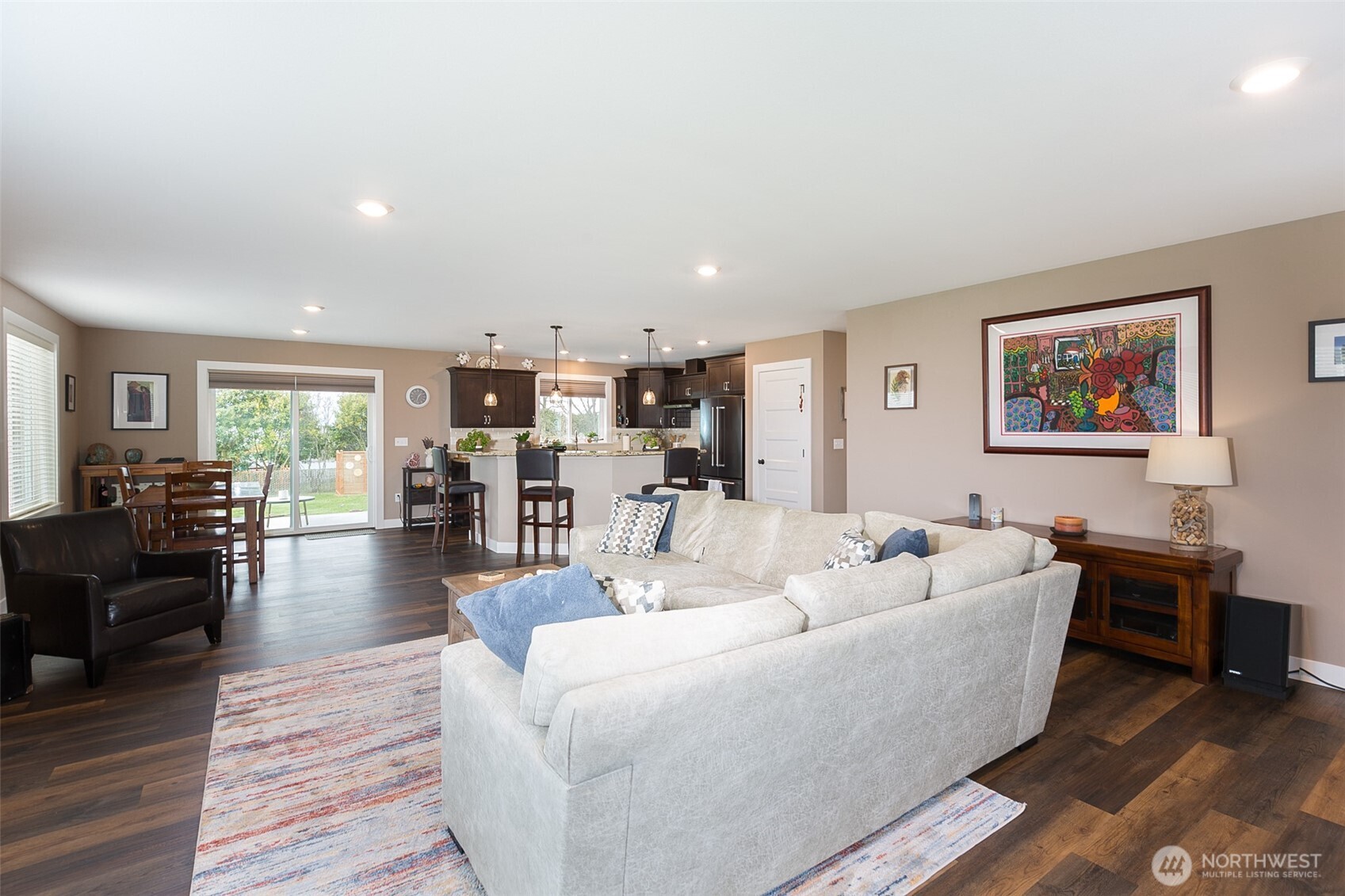 41 Victoria View Street Sequim, WA 98382 - Photo 3 of 40 a living room with furniture and a dining table with wooden floor