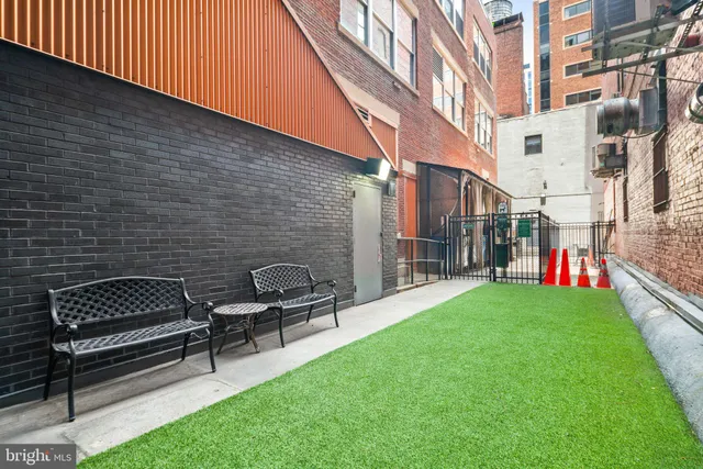 a backyard of a house with outdoor seating