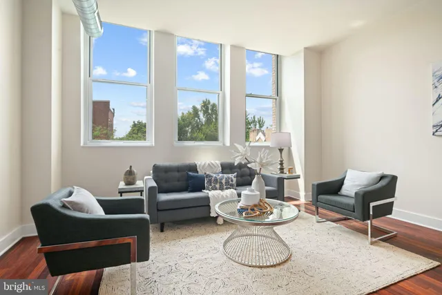a living room with furniture and a window