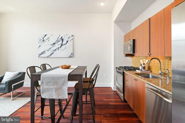 a view of a dining room with furniture and window