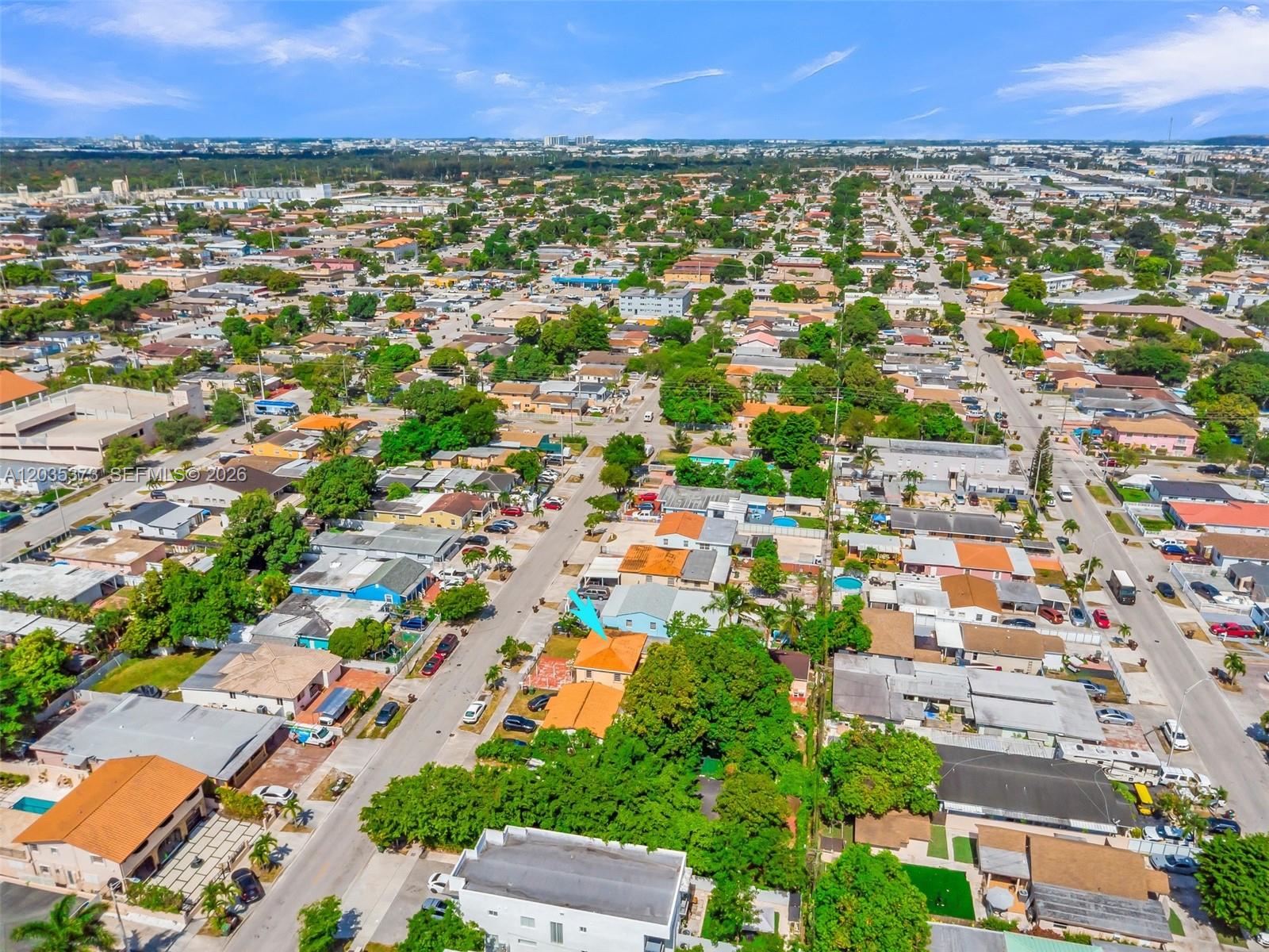 151 East 16th Street Hialeah, FL 33010 - Photo 32 of 37 Blue arrow indicates the home