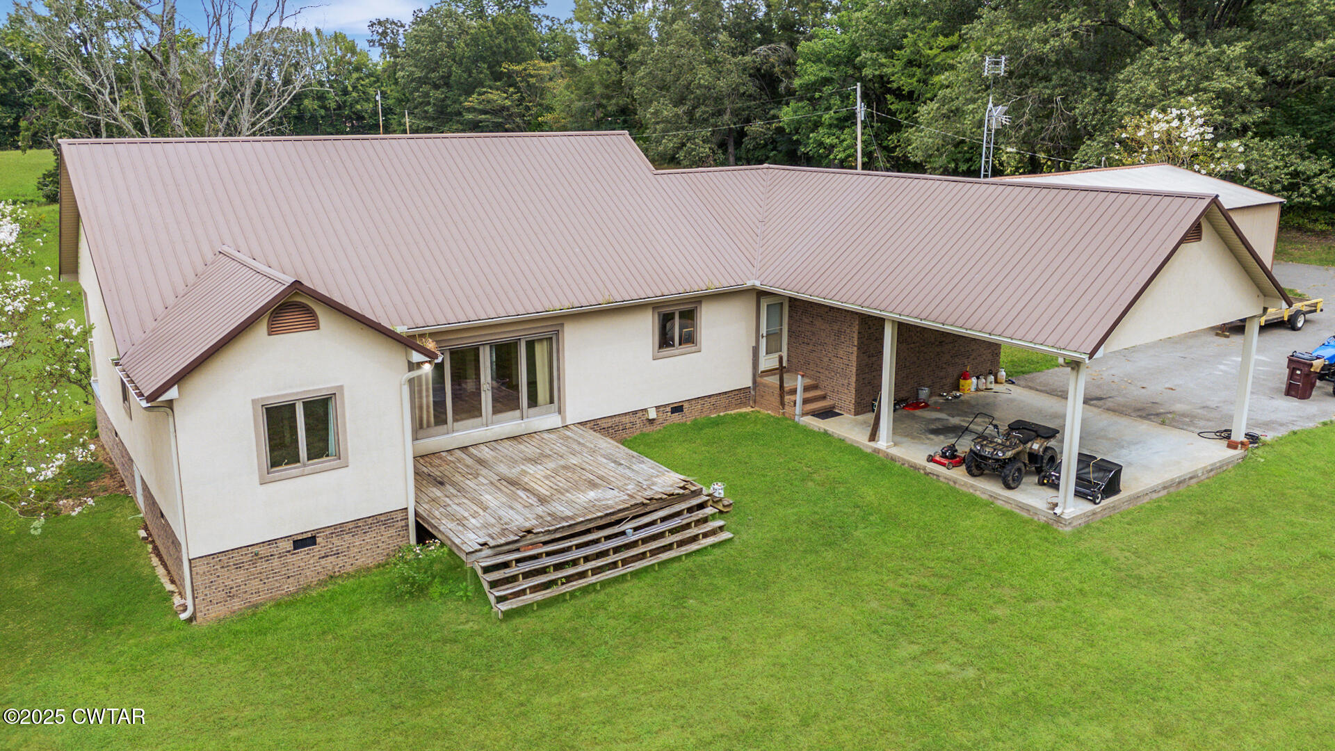 3554 Shades Bridge Road Greenfield, TN 38230 - Photo 36 of 49 a aerial view of a house with a yard and deck