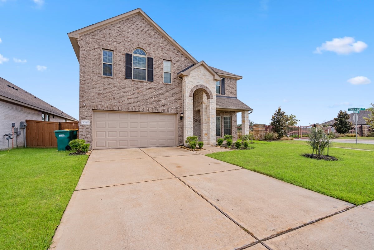 1702 Darwin Cedar Drive Rosharon, TX 77583 - Photo 8 of 44 Double wide driveway leads to a private garage, giving you plenty of space for parking and storage!