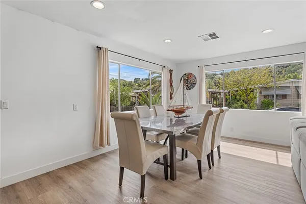 a view of a dining room with furniture window and outside view
