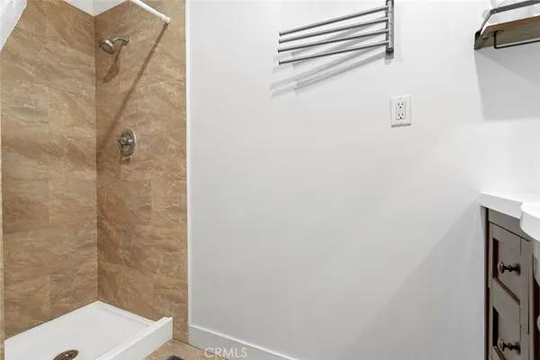 a bathroom with a toilet and shower