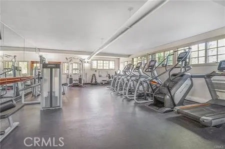 a view of a room with lots of wooden furniture