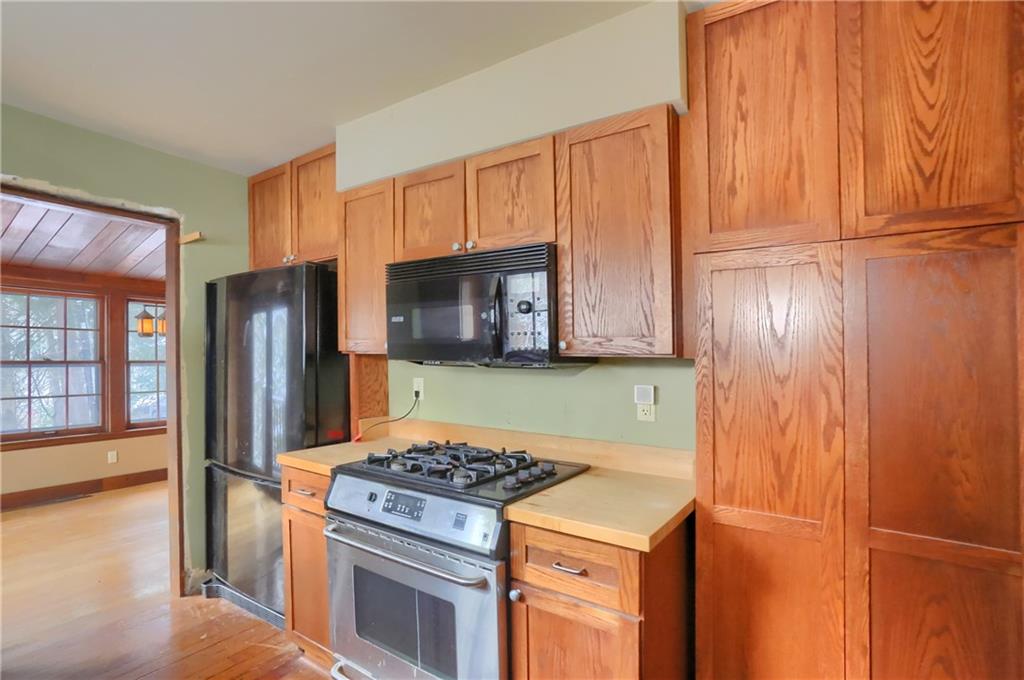 3210 Evergreen Road Pittsburgh, PA 15237 - Photo 25 of 47 a kitchen with a refrigerator stove and cabinets