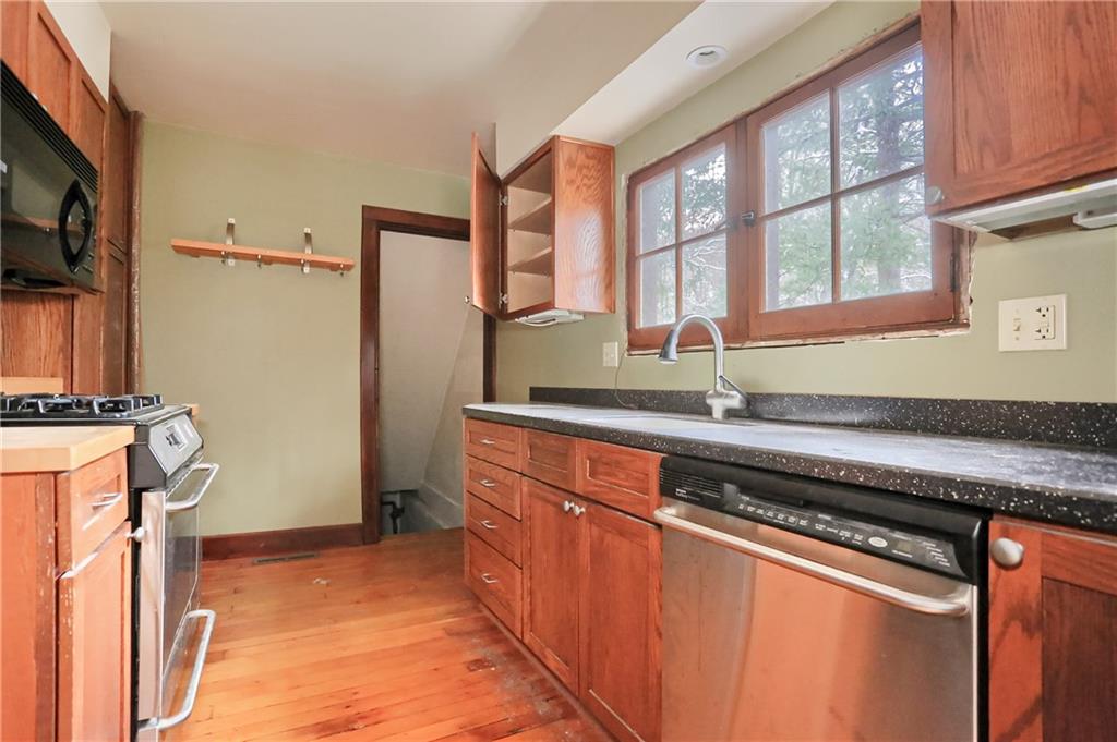 3210 Evergreen Road Pittsburgh, PA 15237 - Photo 27 of 47 a kitchen with stainless steel appliances granite countertop a refrigerator and a sink