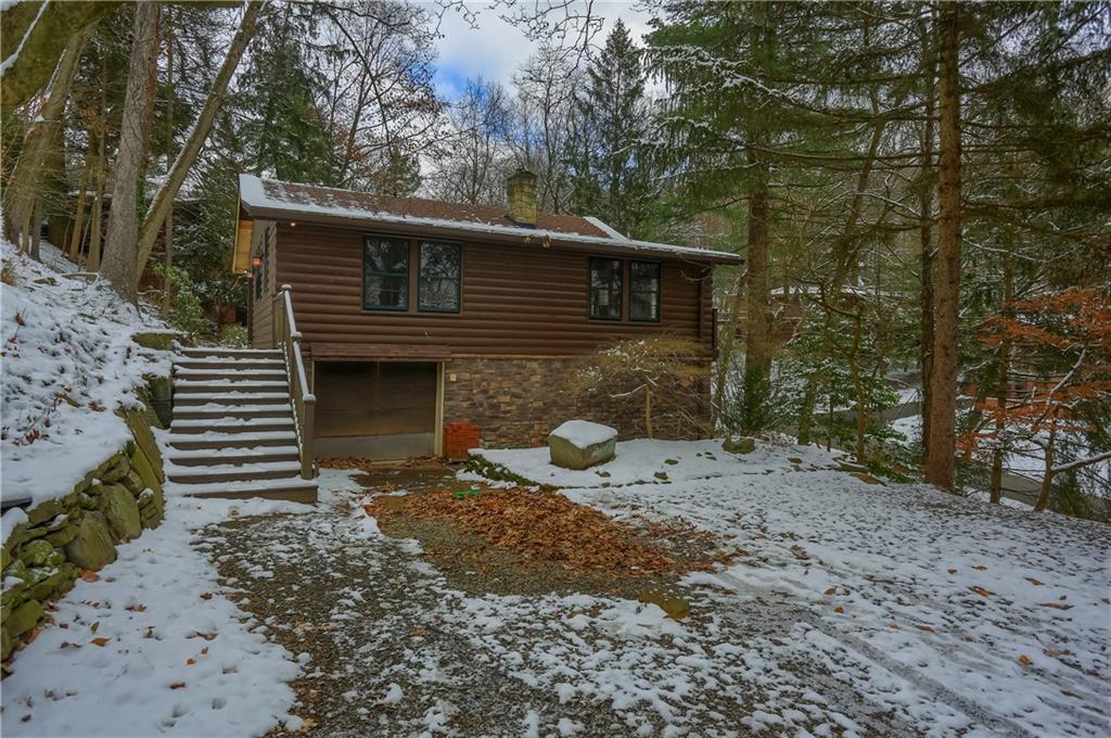 3210 Evergreen Road Pittsburgh, PA 15237 - Photo 7 of 47 a backyard of a house with large trees and wooden fence