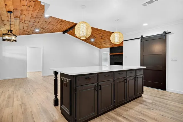 a kitchen with a sink stove and refrigerator