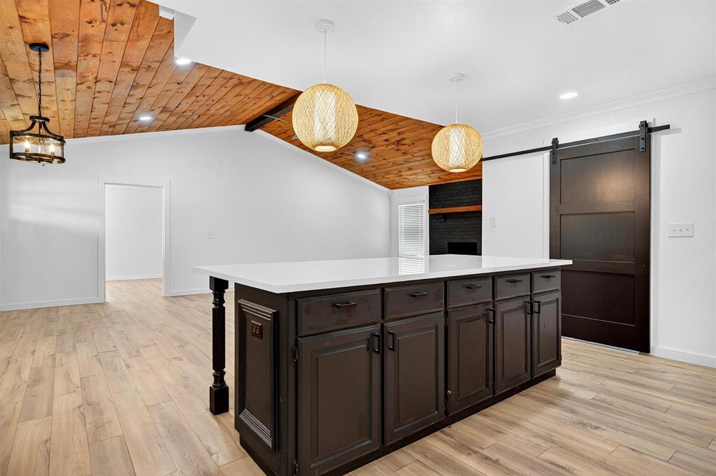 621 Craft Road Bells, TX 75414 - Photo 14 of 40 a kitchen with a sink and a refrigerator